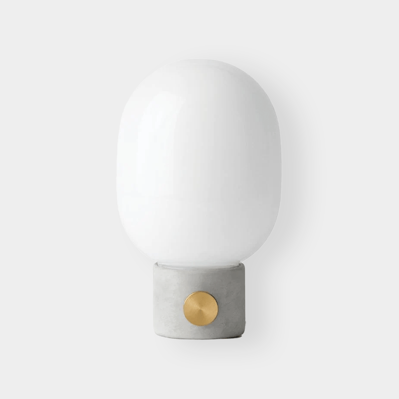 Menu JWDA Concrete Lamp with concrete base, brass dimmer knob, and white glass shade in minimalist modern design