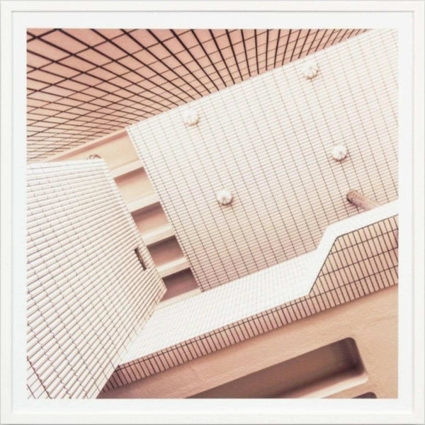 Minimalist framed photographic print of abstract modern architecture with white tiled walls, titled Middle Of Nowhere, 83x83cm.