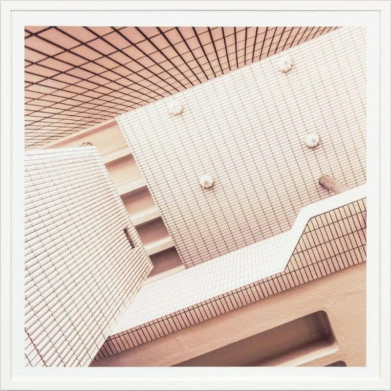 Minimalist framed photographic print of abstract modern architecture with white tiled walls, titled Middle Of Nowhere, 83x83cm.