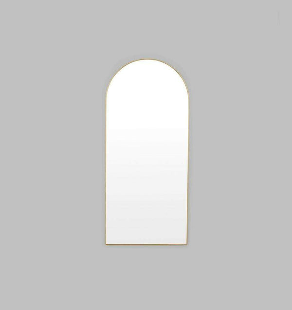 Middle of Nowhere Bjorn brass arch floor mirror with gold leaf frame and minimalist design