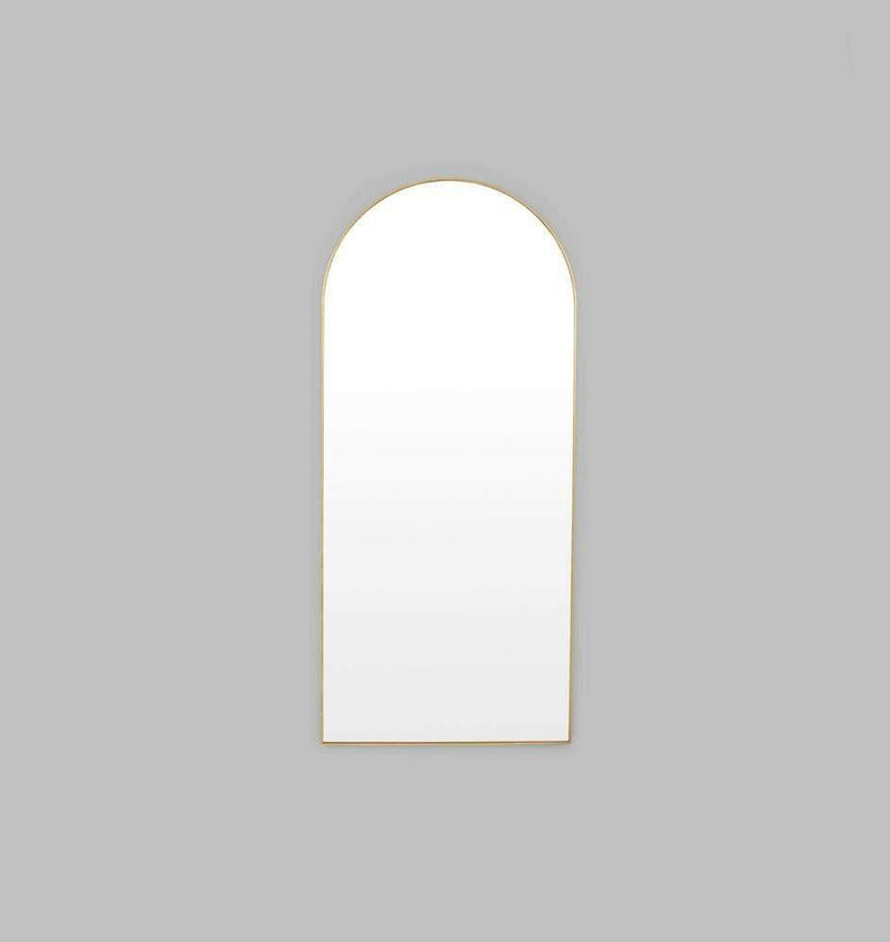Middle of Nowhere Bjorn brass arch floor mirror with gold leaf frame and minimalist design