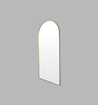 Middle of Nowhere Bjorn arch floor mirror with brass frame and gold leaf finish, modern minimalist design.