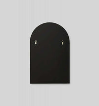 Middle of Nowhere Bjorn black arched wall mirror with D-ring hangers, 55cm x 85cm, minimalist modern design.