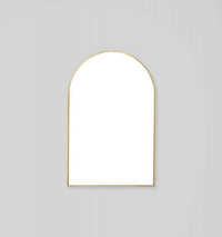 Middle of Nowhere Bjorn arch mirror with brass gold-leaf frame, 55cm by 85cm, elegant vintage finish