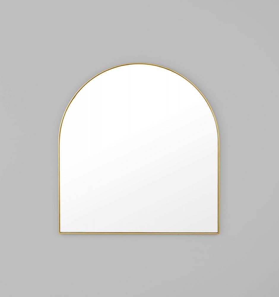 Middle of Nowhere Bjorn arch mirror with hand-applied gold leaf brass frame on gray wall