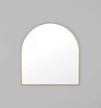Middle of Nowhere Bjorn arch mirror with hand-applied gold leaf brass frame on gray wall