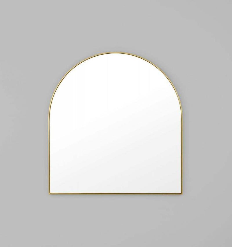 Middle of Nowhere Bjorn arch mirror with hand-applied gold leaf brass frame on gray wall