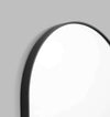 Middle of Nowhere Bjorn oval mirror with black matte wooden frame, 50cm wide and 75cm high, modern minimalist design