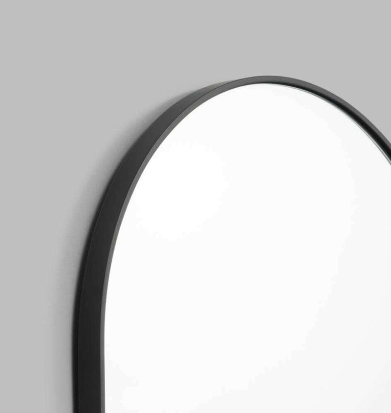 Middle of Nowhere Bjorn oval mirror with black matte wooden frame, 50cm wide and 75cm high, modern minimalist design