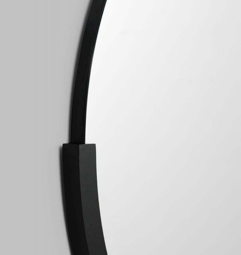 Middle of Nowhere Dawn round black mirror with minimalist design and sleek frame