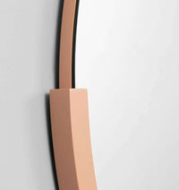 Middle of Nowhere Dawn round desert mirror with minimalist terracotta frame on white wall