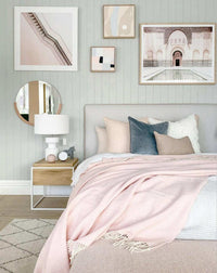 Middle of Nowhere Dawn round desert mirror in a modern bedroom interior with pastel tones and framed artwork on the wall