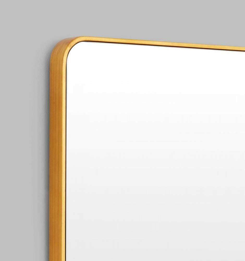 Flynn Curve series brass mirror with rounded corners and antique gold leaf finish, suitable for entry or hallway.