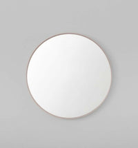 Middle of Nowhere Flynn round blush wooden mirror with matte finish in small and large sizes