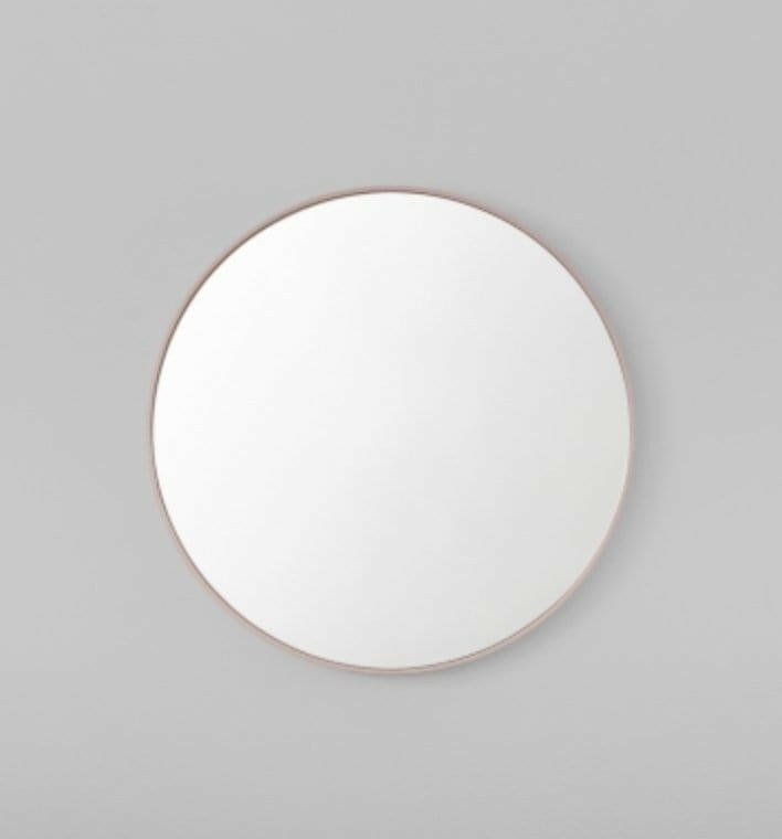 Middle of Nowhere Flynn round blush wooden mirror with matte finish in small and large sizes