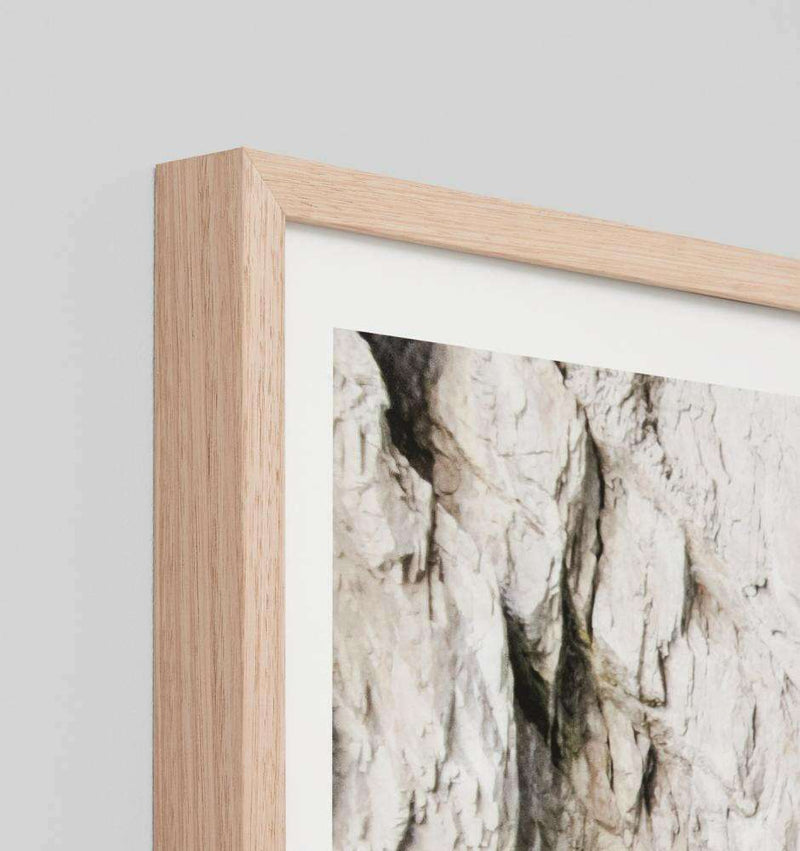 Middle of Nowhere Ocean Passage framed photographic print with natural oak frame showing textured ocean rocks