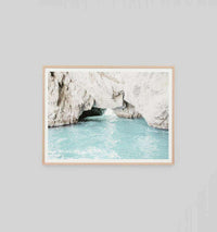 Middle of Nowhere Ocean Passage photographic print featuring turquoise ocean water flowing through rocky cliffs in a natural frame, available in multiple sizes with customizable frame colors.