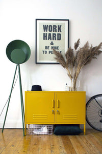 Yellow Mustard Made Locker low console with handles and locks in modern interior setting