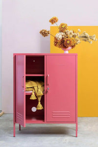 Pink Mustard Made Locker The Midi Berry with two doors, adjustable shelves, and decorative flowers on top against yellow and lavender background