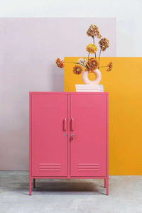Pink Mustard Made Locker The Midi Berry with handles, locks, and air vents in modern room setting