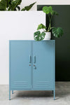 Mustard Made Locker The Midi Ocean blue metal storage cabinet with two doors and plant on top