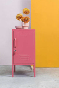 Pink Mustard Made Locker The Shorty Berry with handle, lock, and air vents standing on gray floor against yellow and light purple walls with flowers on top