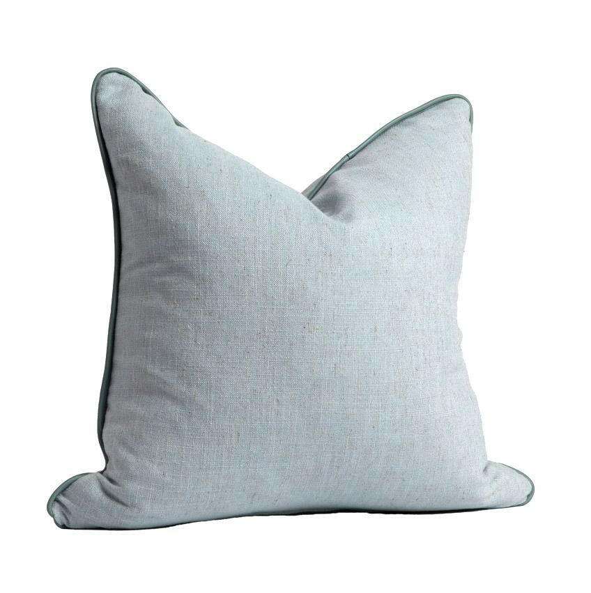 norsu Studio Cushion in Lexus Duck Egg color with blue leather piping, soft fabric, and feather down filling