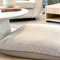 norsu STUDIO floor cushion in Lexus Haze and Parissi Fog with charcoal leather piping | Norsu Interiors