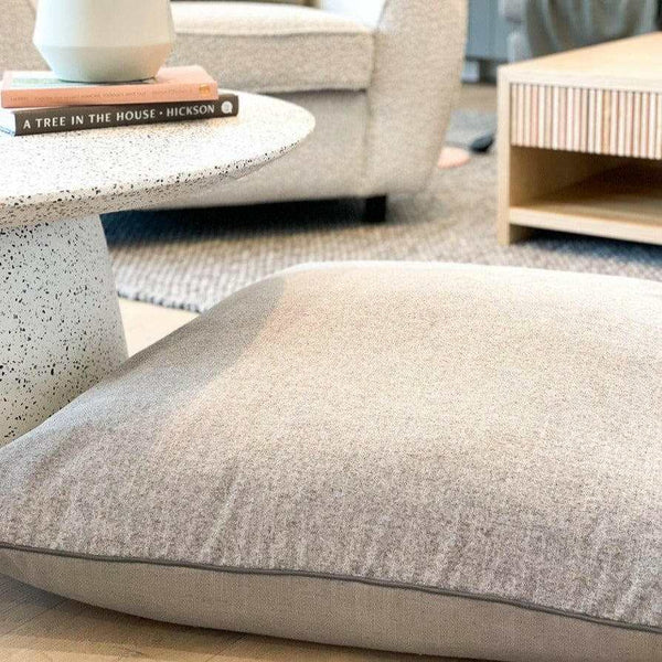 norsu STUDIO floor cushion in Lexus Haze and Parissi Fog with charcoal leather piping | Norsu Interiors