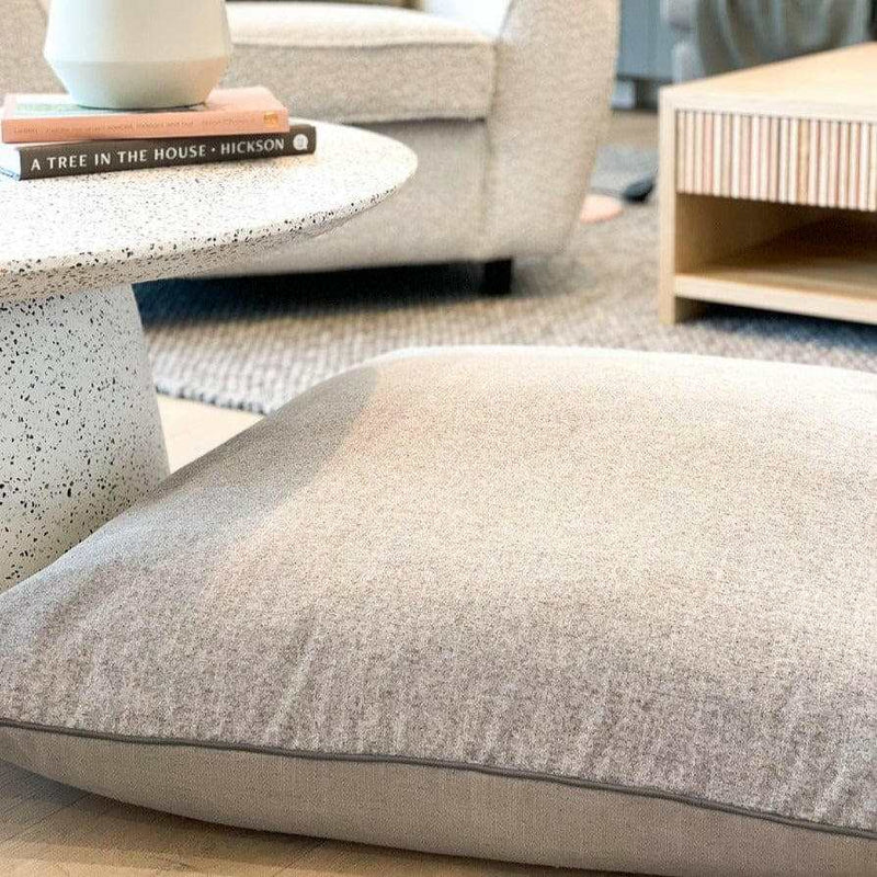 norsu STUDIO floor cushion in Lexus Haze and Parissi Fog with charcoal leather piping | Norsu Interiors