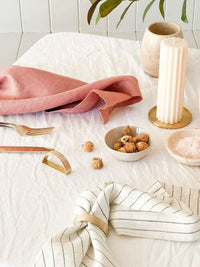 Rendr 100% linen striped olive napkins set of four on table with decor and snacks