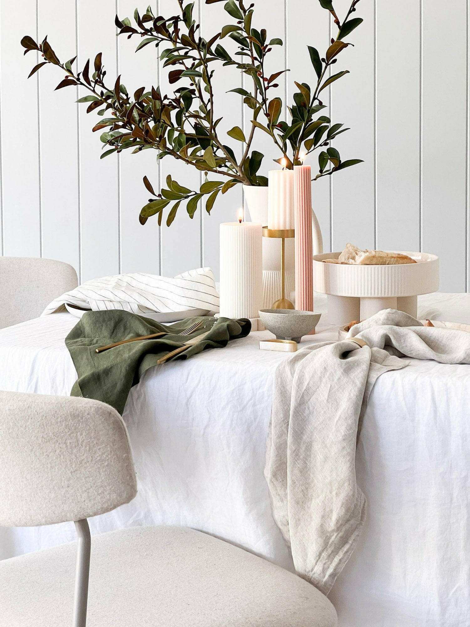 Set of four Rendr 100% linen natural napkins on a white dining table with decor