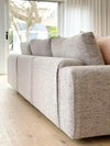 Modern grey norsuHOME sofa with soft cushions in bright living room