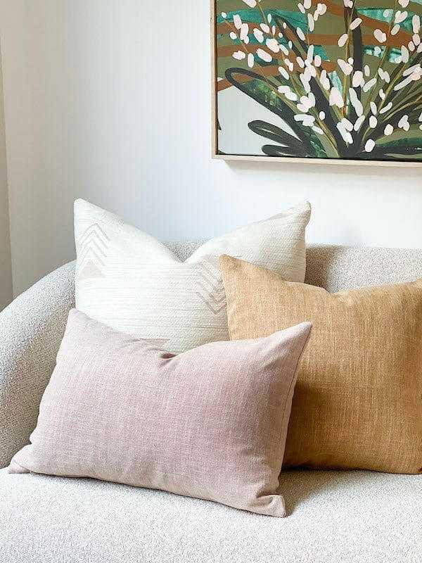 Blush norsu Studio Washable Cushion on sofa with neutral decor