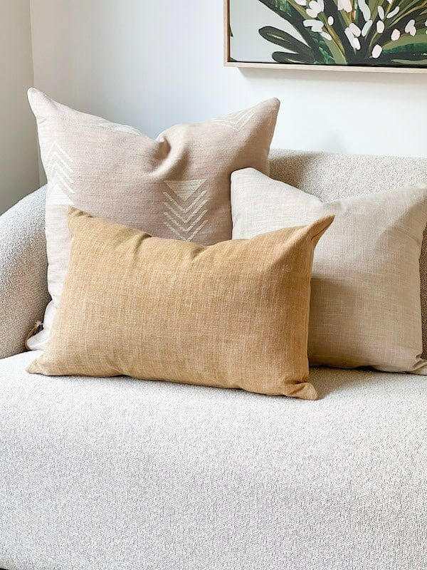 Norsu Studio Washable Cushion set with honeycomb pattern in neutral tones on a beige sofa