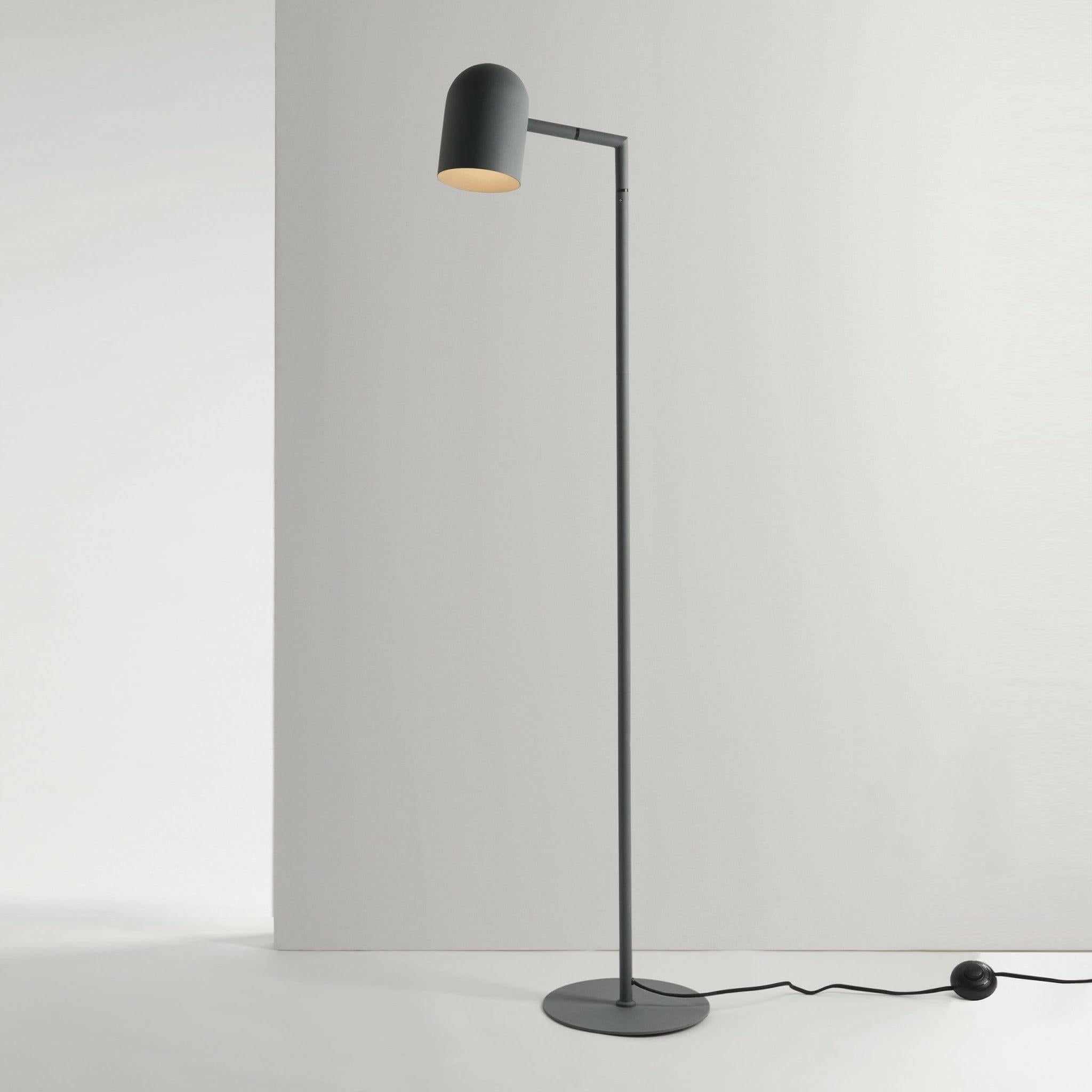 Charcoal Pia floor lamp with architectural lines and adjustable head, suitable for bedroom or office lighting.