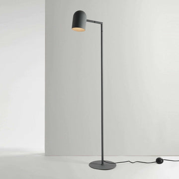 Charcoal Pia floor lamp with architectural lines and adjustable head, suitable for bedroom or office lighting.
