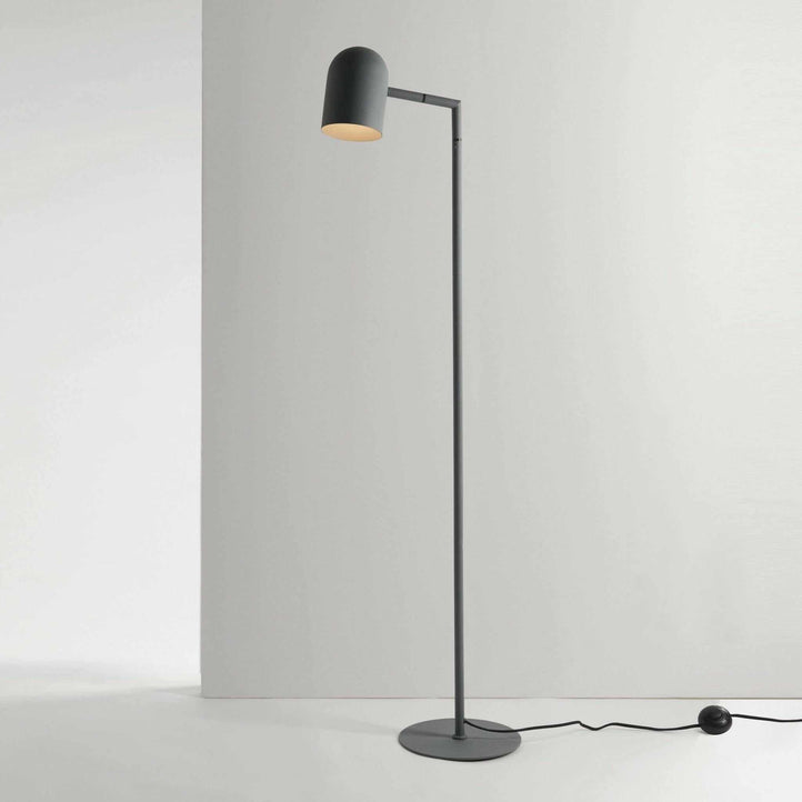 Charcoal Pia floor lamp with architectural lines and adjustable head, suitable for bedroom or office lighting.