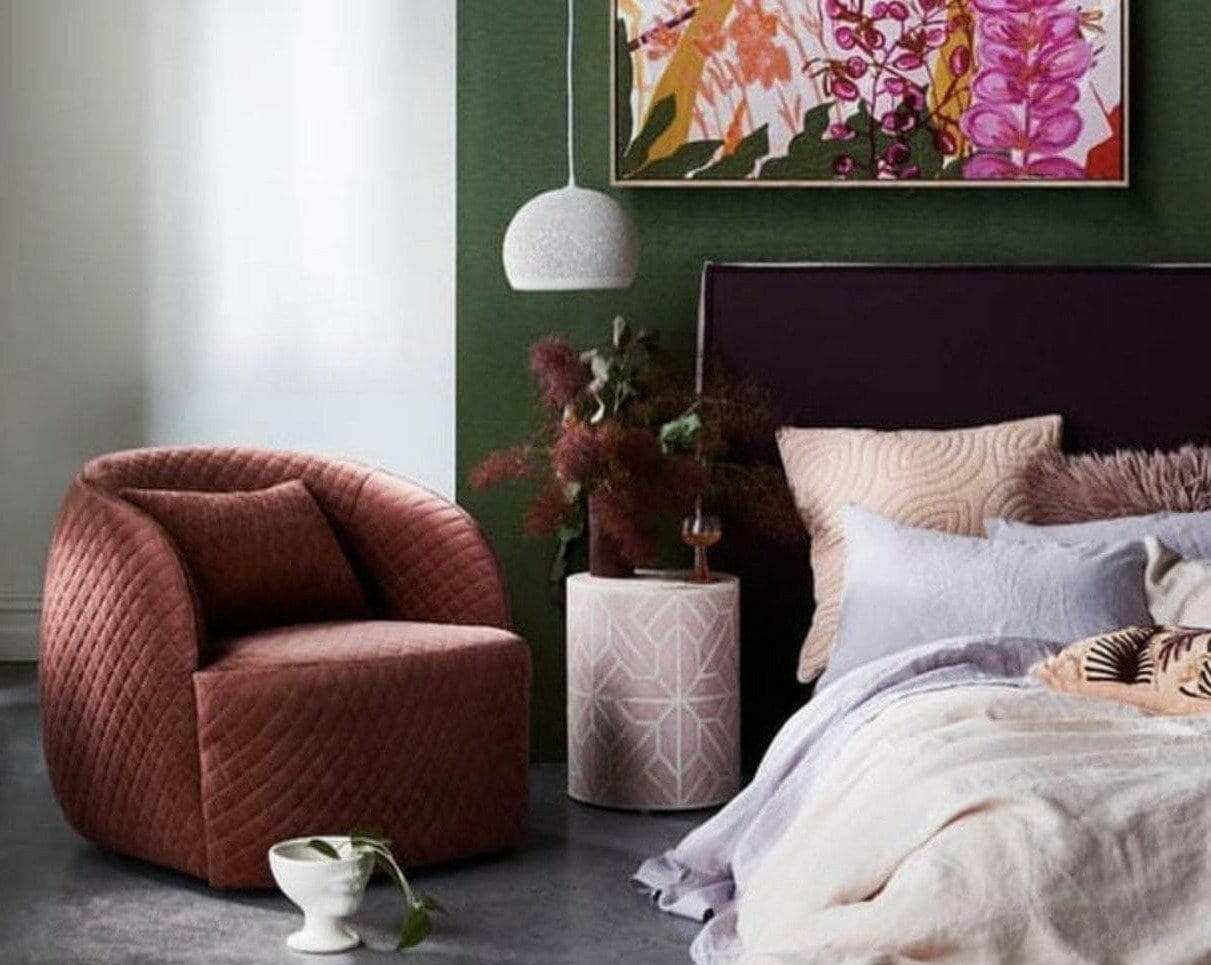 POTT Lighting SpongeUp Pendant white hanging above bedside table in modern bedroom with green wall and brown armchair