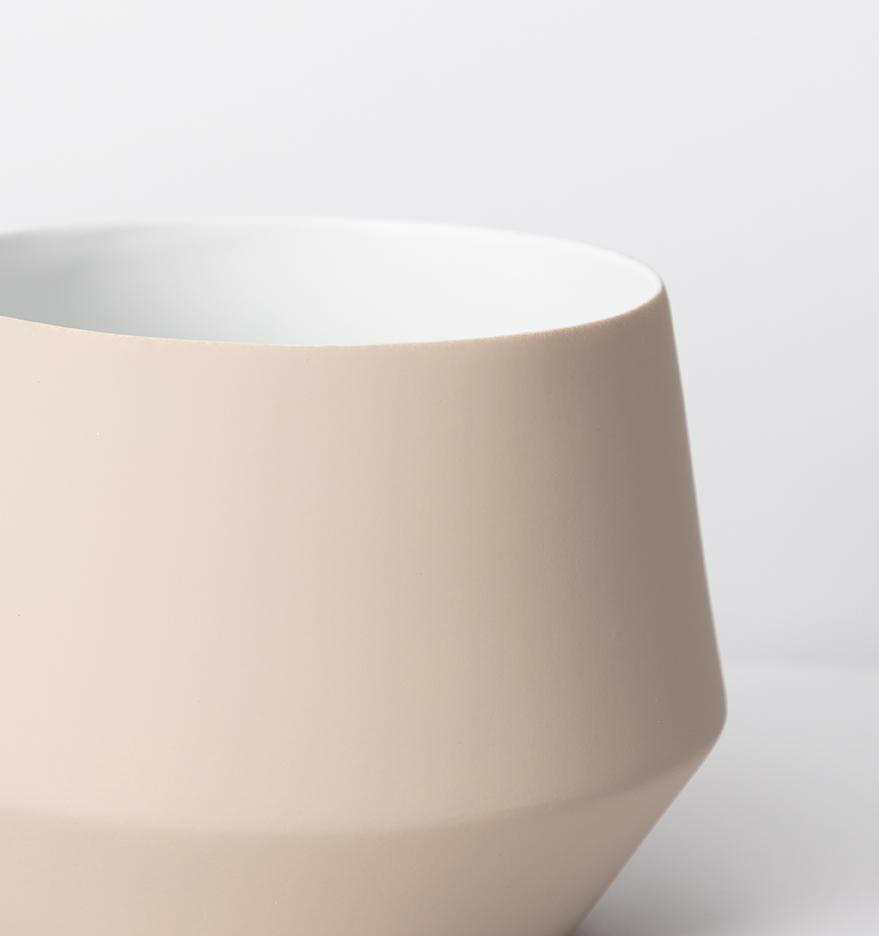 Small nude Samso Pot Small porcelain planter with matte silicone exterior and glossy white interior, designed for standard potted plants without drainage hole.