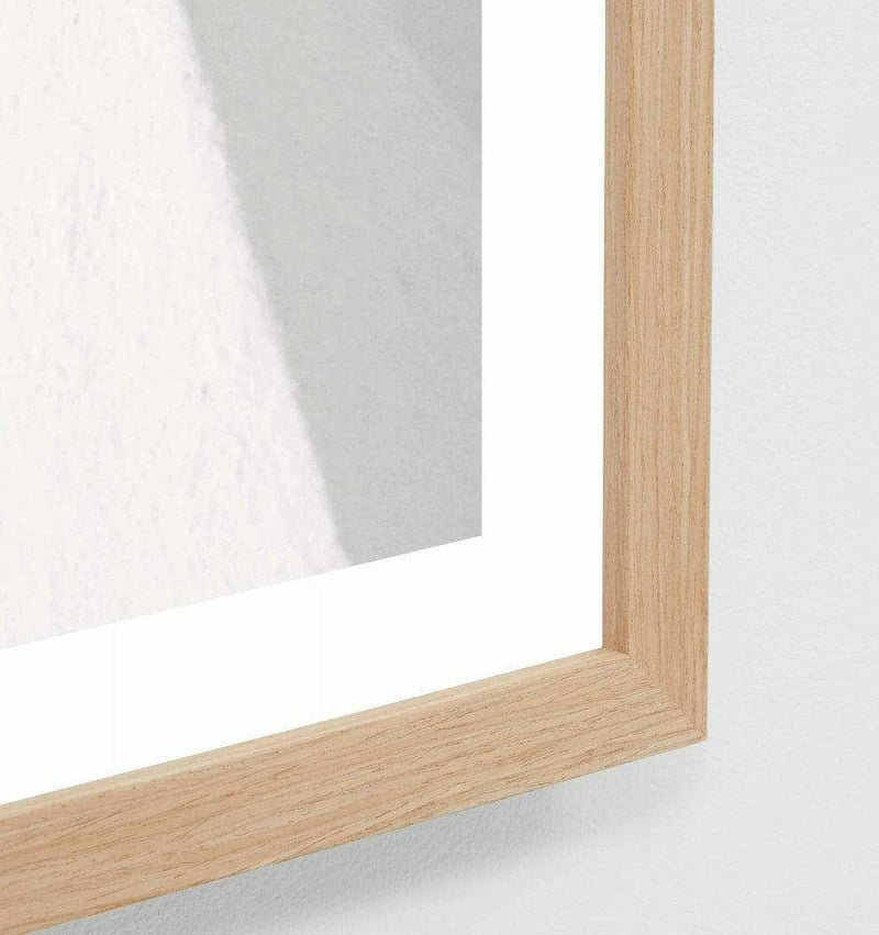 Close-up of Middle of Nowhere Shadow Villa Print framed in oak wood