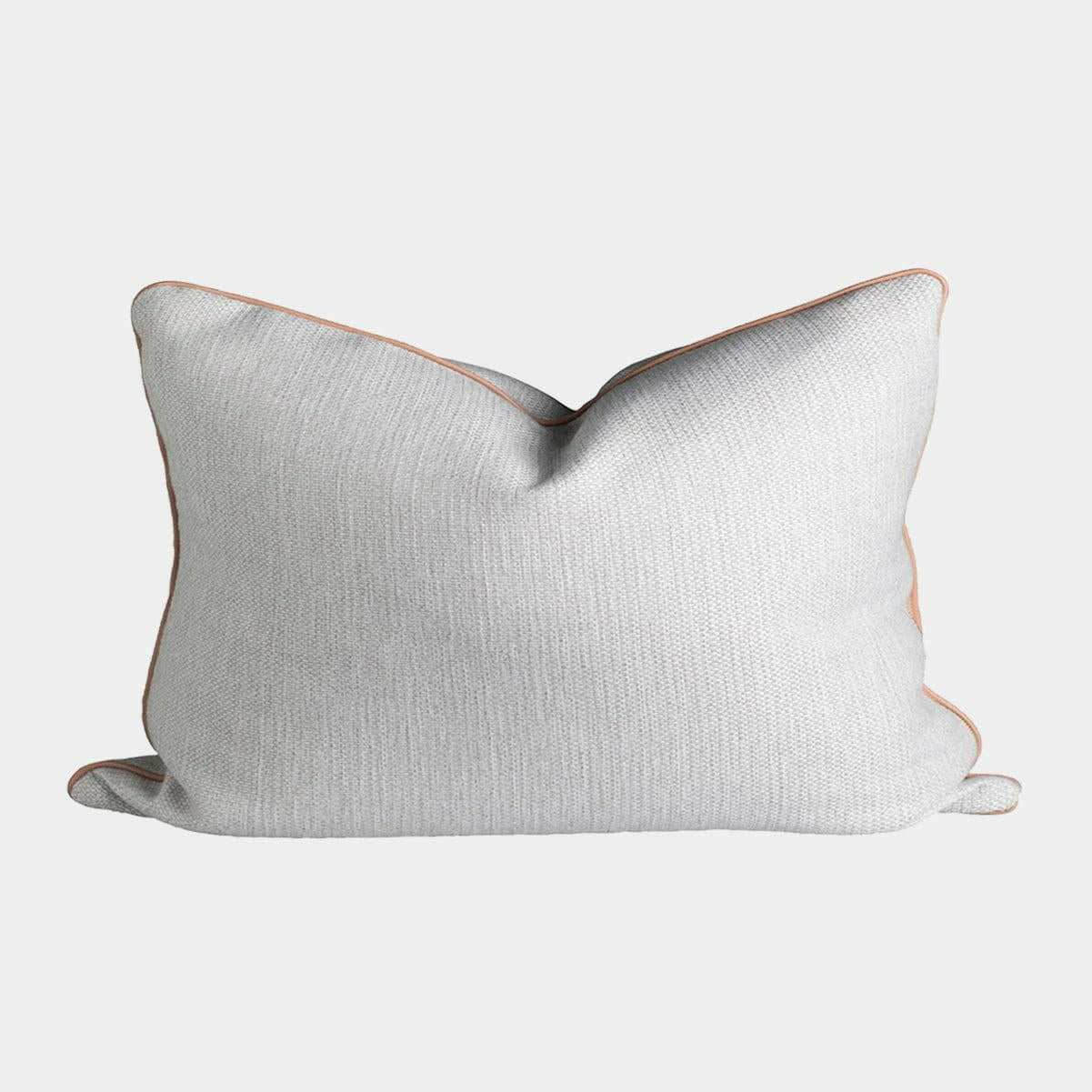 norsu Studio Cushion in Lindeman Snow fabric with blush piping, rectangular soft decorative pillow