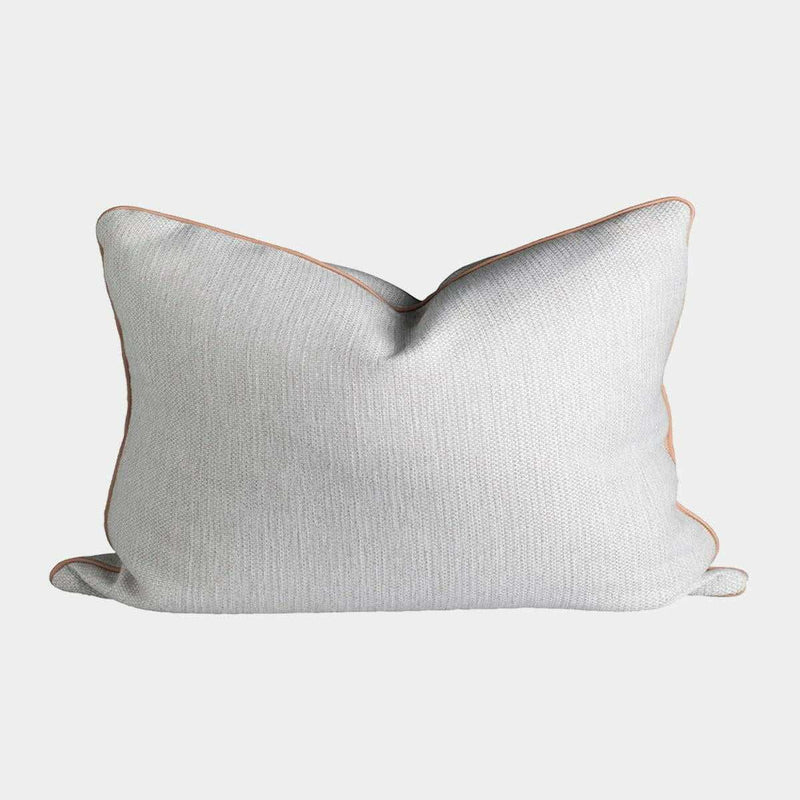 norsu Studio Cushion in Lindeman Snow fabric with blush piping, rectangular soft decorative pillow
