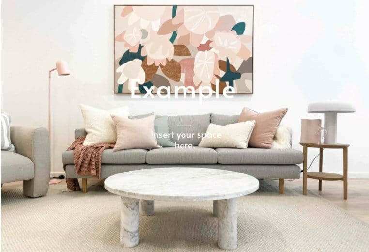 Modern living room with styled round marble coffee table, neutral sofa with pillows, abstract wall art, and soft beige rug.