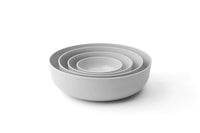 Set of smoke-colored nesting bowls in various sizes from the Nesting Bowls Collection, lightweight and snap-tight design