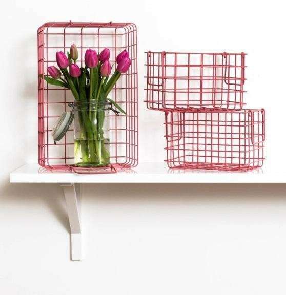 Set of berry baskets for all storage with one large and two small wire baskets on white shelf