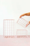 Set of three blush wire baskets in big and small sizes for locker storage and organization
