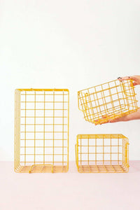 Set of three mustard baskets in varying sizes for locker and shelf storage organization