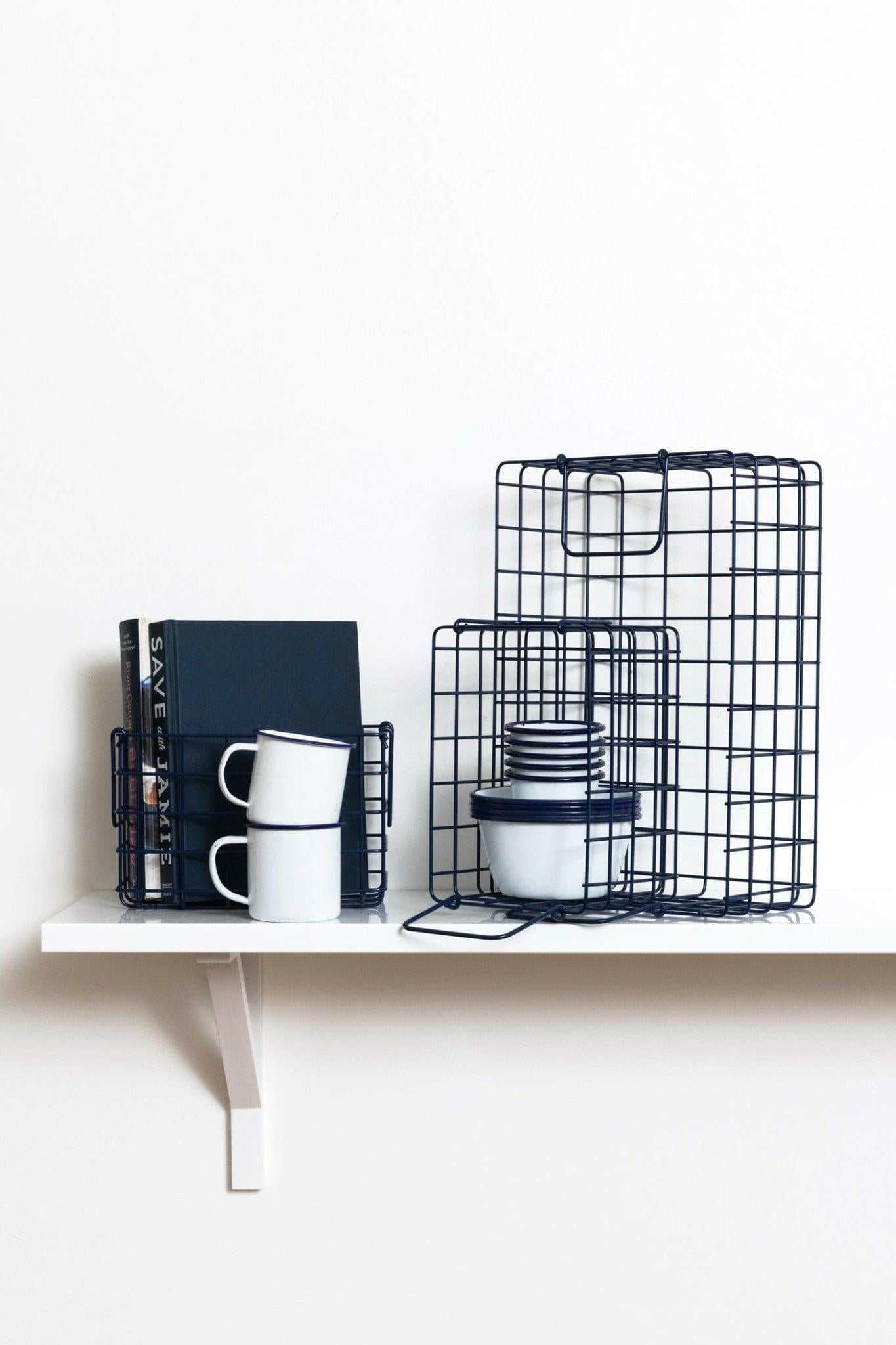 Set of navy wire baskets designed for organizing bits and bobs with different sizes fitting locker shelves.