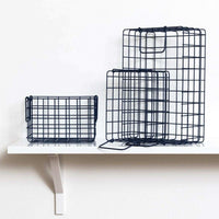 Set of navy metal wire baskets for all for bits and bobs, designed to fit inside lockers and maximize storage.